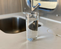 Glass of water on Airstream kitchen counter