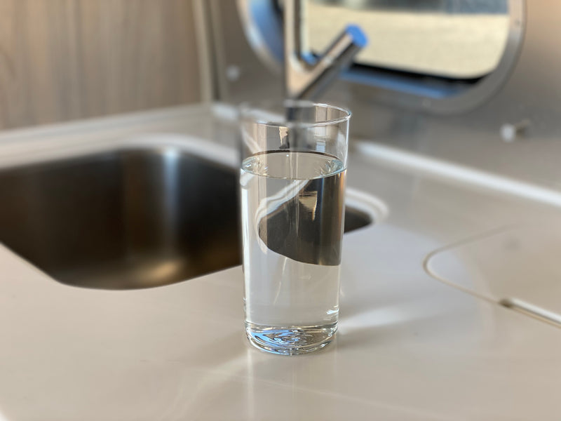 Glass of water on Airstream kitchen counter